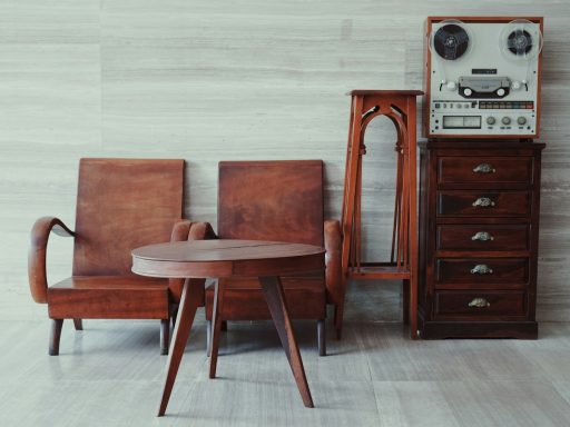 brown wooden chairs, table, and cabinet